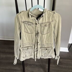 Worn out green jean jacket